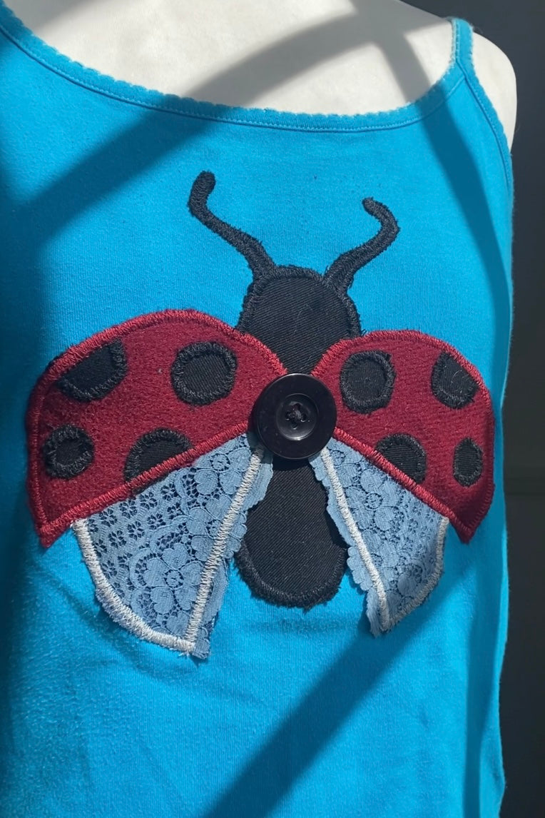 light blue Cami with ladybird 